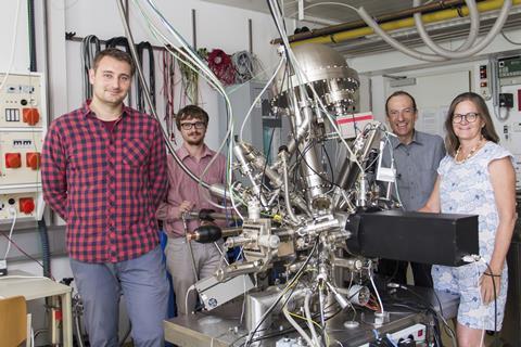 A photograph of Jan Balajka, Jirí Pavelec, Michael Schmid and Ulrike Diebold in the lab
